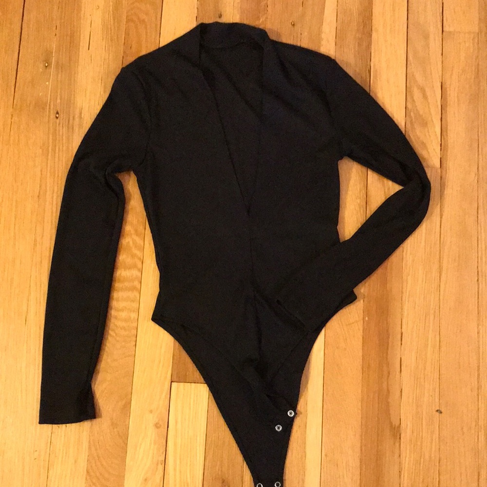 Deep V-neck, ribbed, long sleeve black bodysuit